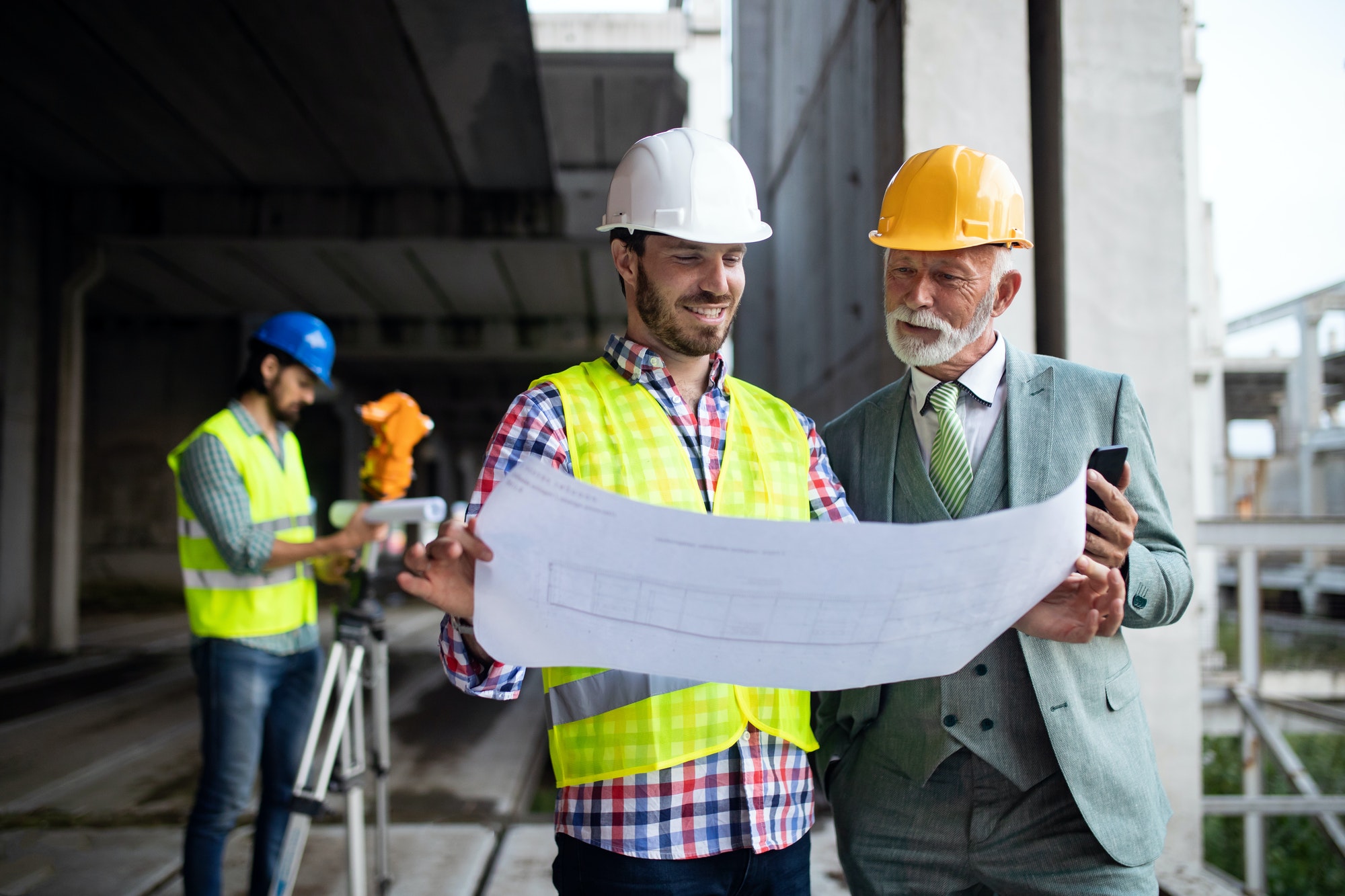 construction-engineer-with-foreman-worker-checking-construction-site.jpg